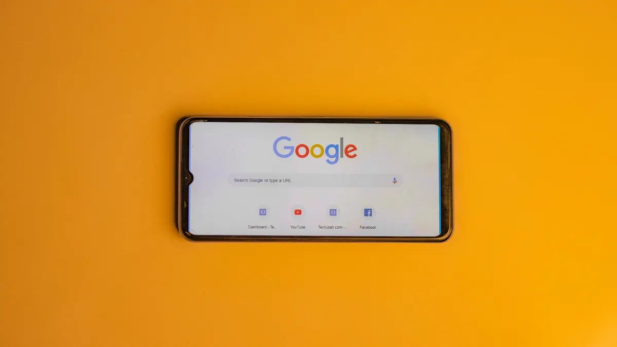 Set up automated XML sitemap generation and auto-submission to Google Search Console — Smart Phone with a Google Search 